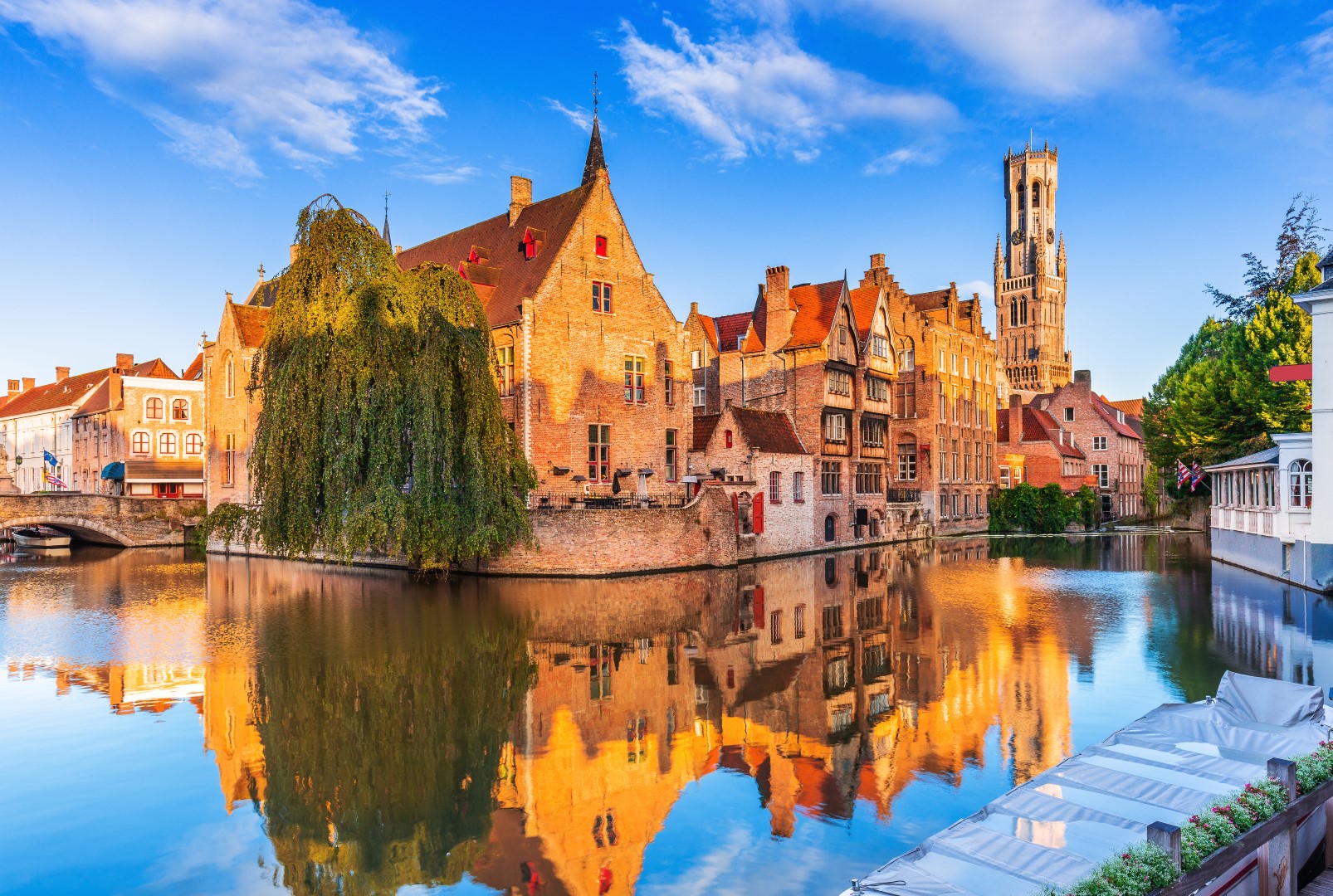 Bruges, Belgium. The Rozenhoedkaai canal in Bruges with the Belfry AdobeStock_277500121 (Large).jpeg Bruges, Belgium. The Rozenhoedkaai canal in Bruges with the Belfry AdobeStock_277500121 (Large).jpeg